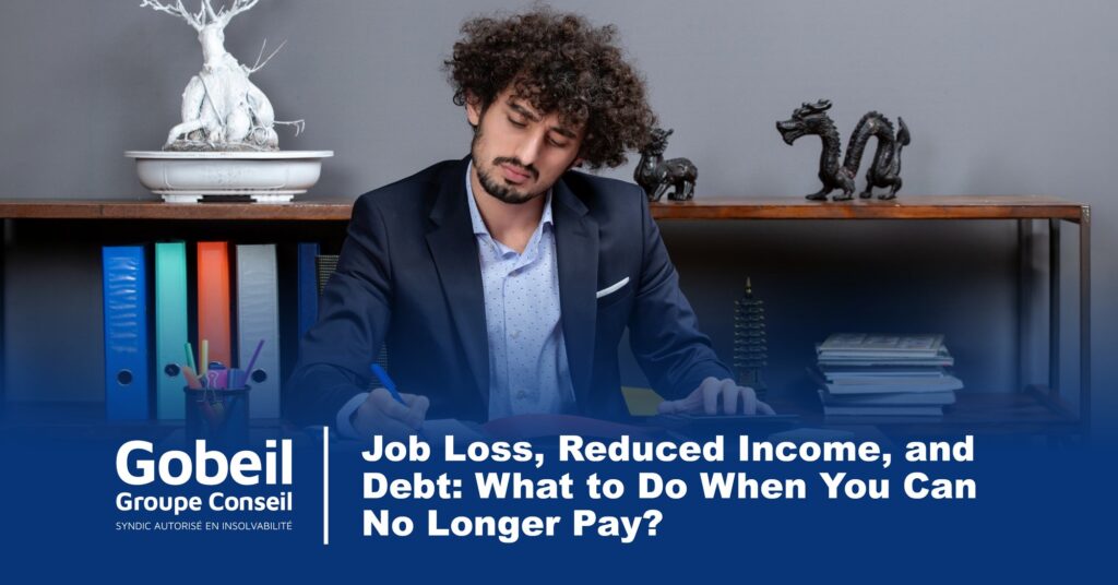 Worried man calculating his budget at his desk after a job loss and reduced income